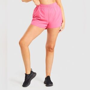 Gymshark ESSENTIAL LOOSE TRAINING SHORTS. Size: XS. Color: Pink